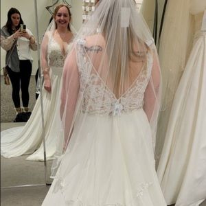 New with tags. Never altered. Size 12 wedding dress. Ivory. Bought @ David’s